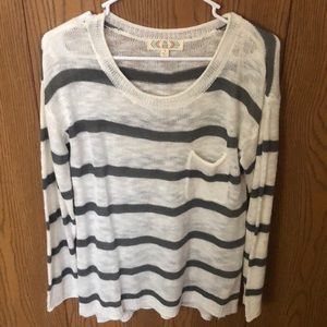 Loose flowy white and gray striped sweater.